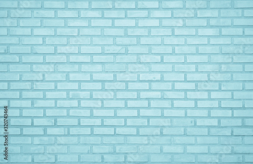 Pastel Blue and White brick wall texture background. Brickwork painted of blue color interior rock old pattern clean concrete grid uneven brick design stack. Home or office design backdrop decoration.
