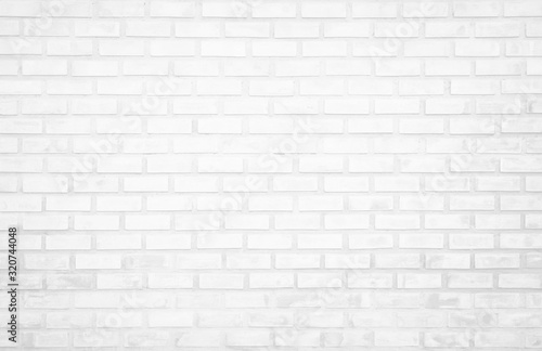 White brick wall texture background in room at subway. Brickwork stonework interior  rock old clean concrete grid uneven abstract weathered bricks tile design  horizontal architecture wallpaper.