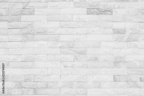 Medieval natural stone wall texture background or boundary the rock seamless abstract and decor fragment of design vintage wallpaper pattern chipped ancient from white color for interior copy space.