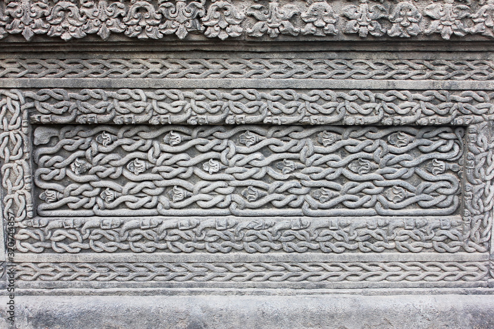 Carved design on the outer walls of Shiva temple in Ahilyabai Holkar fort, Maheswar, Khargone, Madhya Pradesh, India