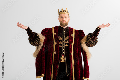 king with crown showing outstretched hands isolated on grey photo