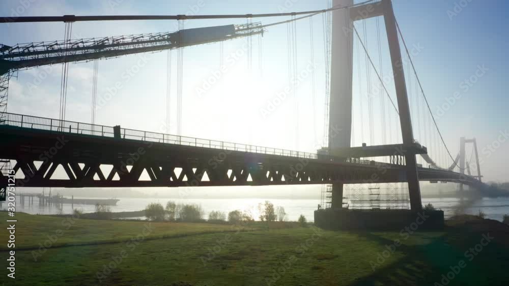 Beautiful Big Suspension Bridge in Emmerich Germany with Golden Sunlight Beautiful Big Suspension Bridge in Emmerich Germany with Golden Sunlight
