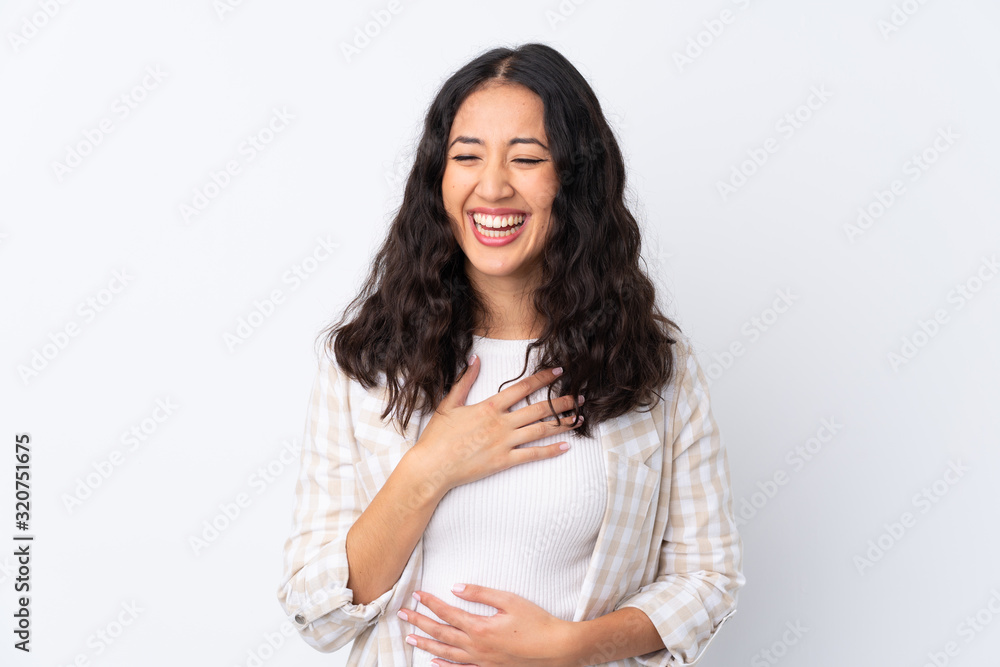 Mixed race woman over isolated white background smiling a lot Mixed race woman over isolated white background smiling a lot
