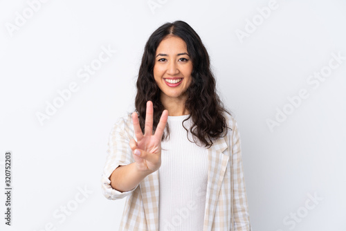 Canvas-taulu Mixed race woman over isolated white background happy and counting three with fi