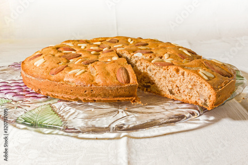 Zelten, rustic South Tyrolean cake on white tablecloth. photo