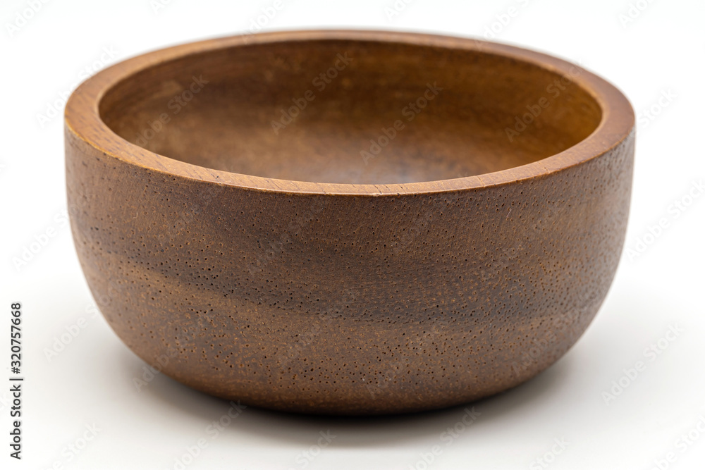 Close up a wooden bowl isolate on white background. Close up a wooden bowl isolate on white background.