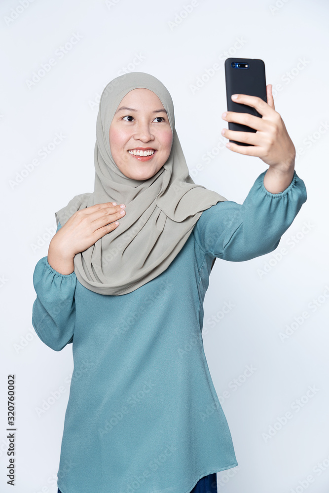 Woman taking selfie with her mobile phone. Woman taking selfie with her mobile phone.