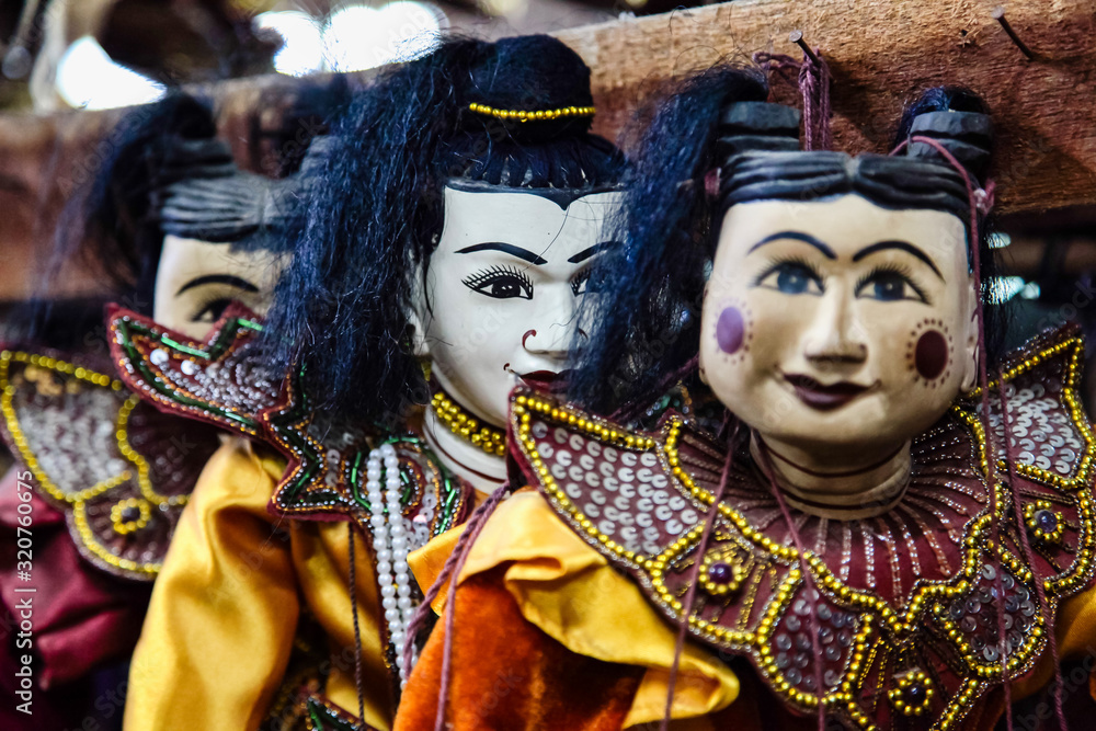 Traditional handicraft puppets are sold in a market at Mandalay, Myanmar.