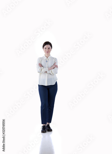 Fotografie Portrait of cheerful young woman standing arms crossed over white background