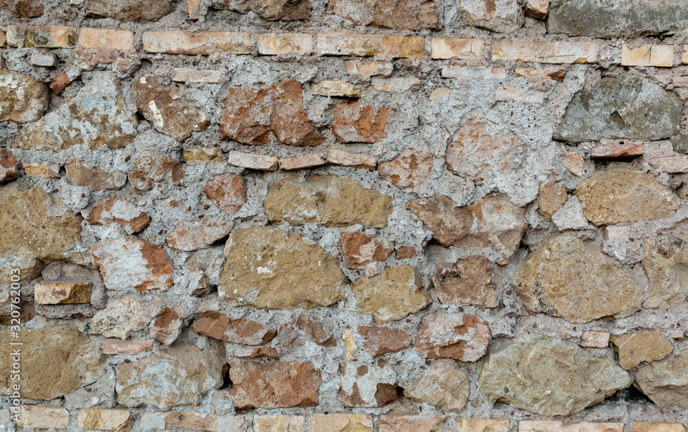 Old brick walls background and texture. The texture of the brick. Grungy old red brick wall. Old brick walls background and texture. The texture of the brick. Grungy old red brick wall.