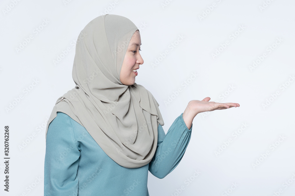 Woman pointing her hands out showing to subject. Woman pointing her hands out showing to subject.