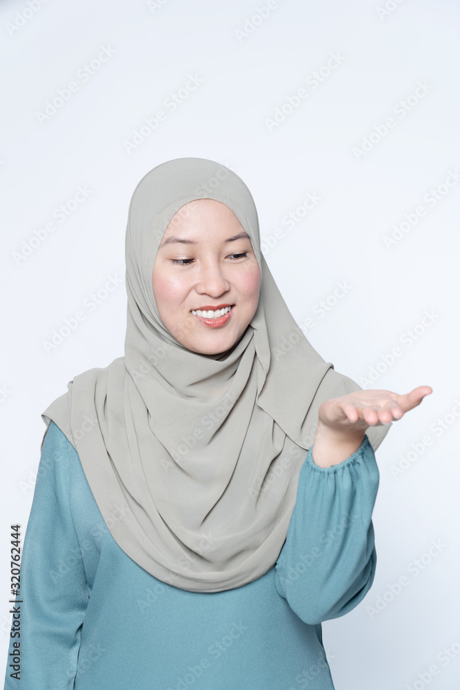 Woman pointing her hands out showing to subject. Woman pointing her hands out showing to subject.