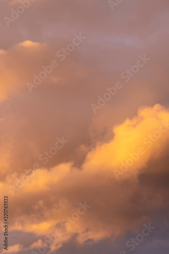 evening sky with beautifully sunlit clouds as a natural background