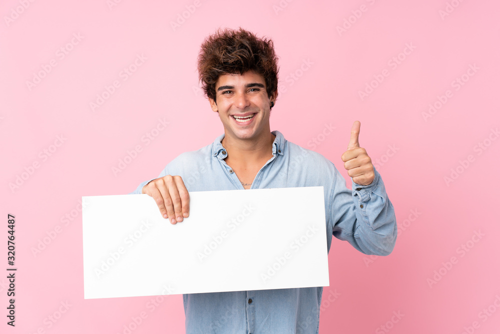 Young caucasian man over isolated pink background holding an empty white placard for insert a concept Young caucasian man over isolated pink background holding an empty white placard for insert a concept