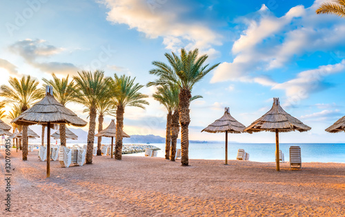 Relaxing atmosphere on the central public beach of Eilat - famous tourist resort and recreational city in Israel