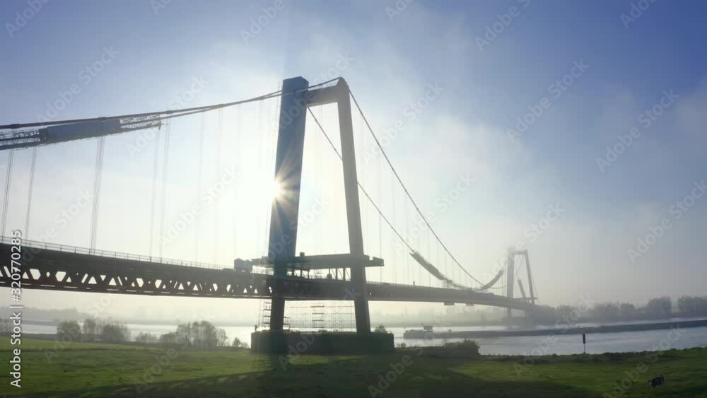 Beautiful Big Suspension Bridge in Emmerich Germany with Golden Sunlight Beautiful Big Suspension Bridge in Emmerich Germany with Golden Sunlight