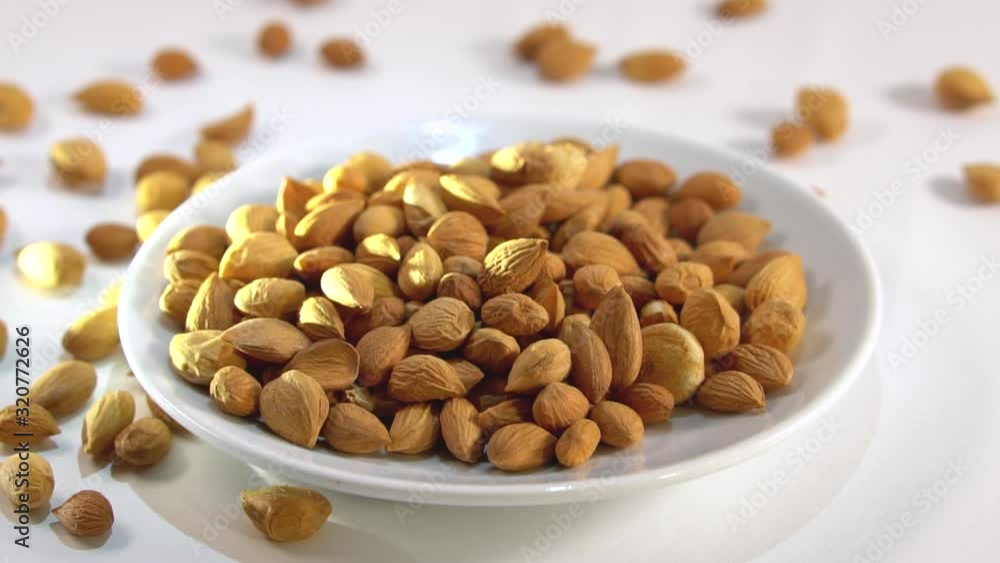 Migdal on a white isolated background. Food nuts for your video editing design. Theme of cooking and cooking Migdal on a white isolated background. Food nuts for your video editing design. Theme of cooking and cooking