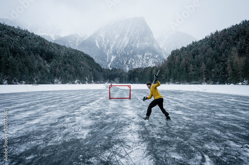 Canvas Print Ice hockey player shoots and scores