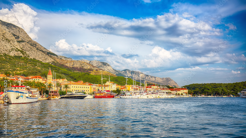Famous Adriatic resort Makarska with picturesque harbor and touristic boats