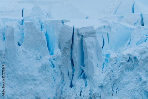 Glacier wall, Paradise Harbor, also known as Paradise Bay, behind Lemaire and Bryde Islands in Antarctica.