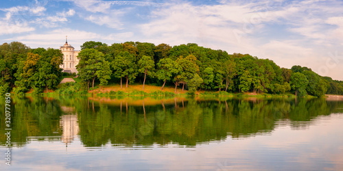 Fototapeta Naklejka Na Ścianę i Meble -  Beautiful panorama of the river bank along the park on a bright sunny day