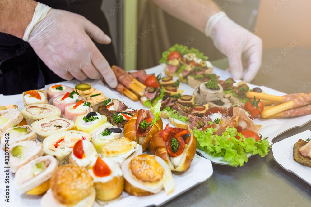 Buffet meal preparation and serving at restaurant. Buffet meal preparation and serving at restaurant.
