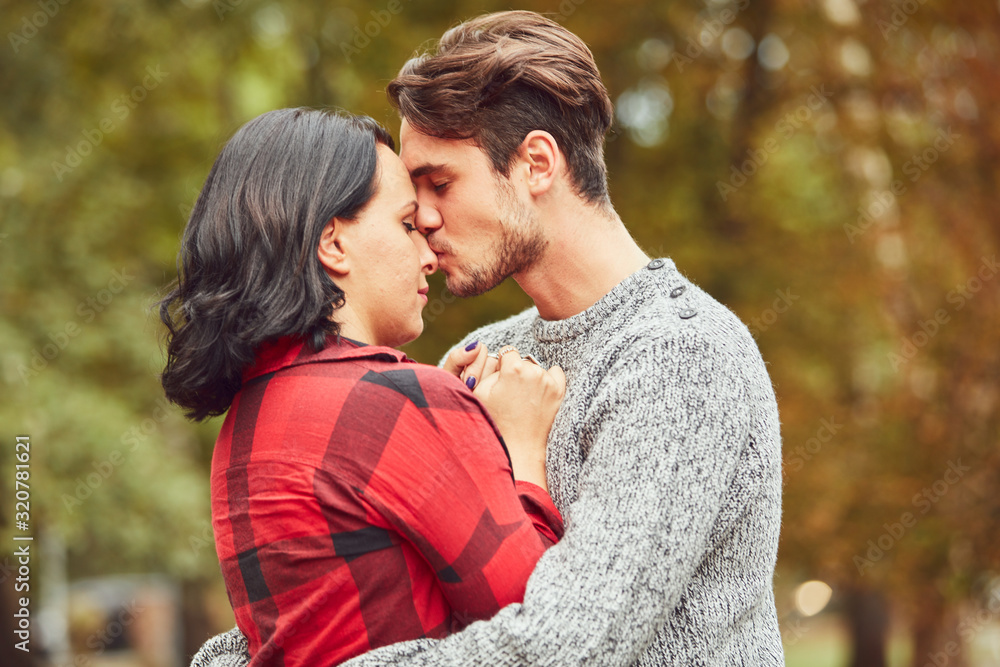 Couple in love hugging and kissing outdoors. Love concept. Couple in love hugging and kissing outdoors. Love concept.