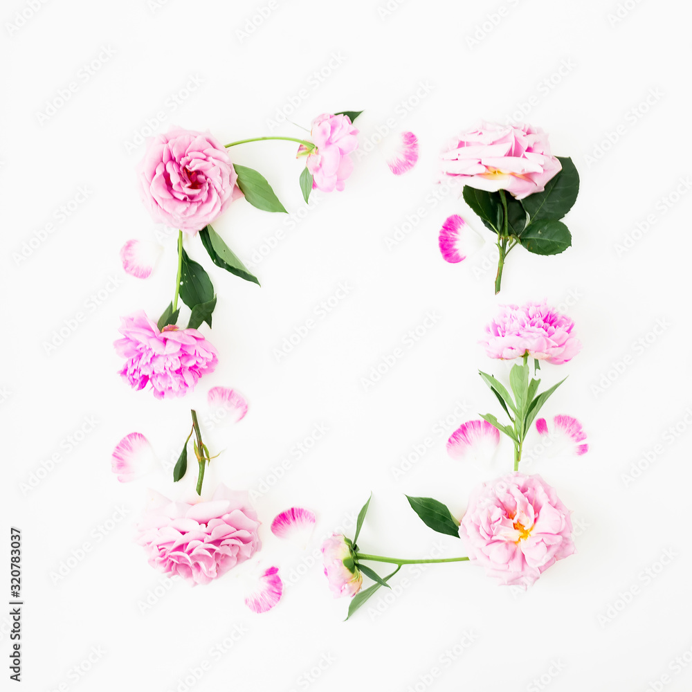 Floral frame of pink flowers on white background. Flat lay, top view. Spring time composition