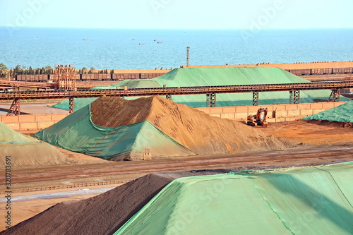 Type of cargo terminal and cranes, berths for transshipment of bulk cargo iron ore. Port Rizhao, China. photo