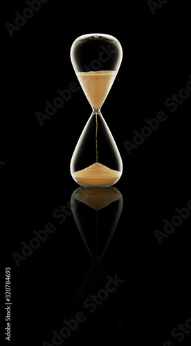 Hour glass on black background.