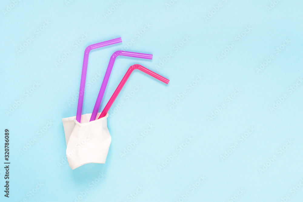 plastic waste, plastic utensils on a blue background. The concept of waste disposal and ecology. Zero waste Flat lay, top view plastic waste, plastic utensils on a blue background. The concept of waste disposal and ecology. Zero waste Flat lay, top view