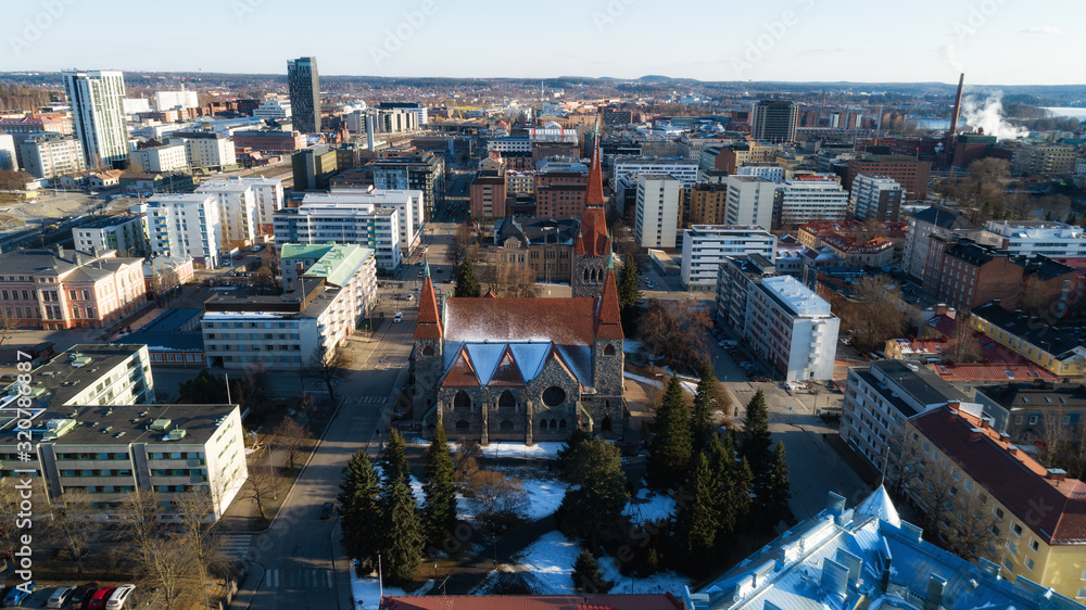 Aerial view of beautiful city Tampere at spring. Cathedral with colorful buildings. Finland
