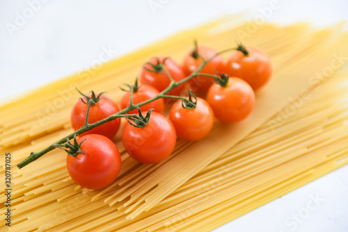 raw spaghetti italian pasta uncooked spaghetti yellow long with tomato ready to cook in the restaurant italian food and menu