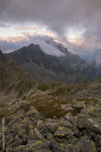 Fototapeta Naklejka Na Ścianę i Meble -  Low clouds touching mountain top