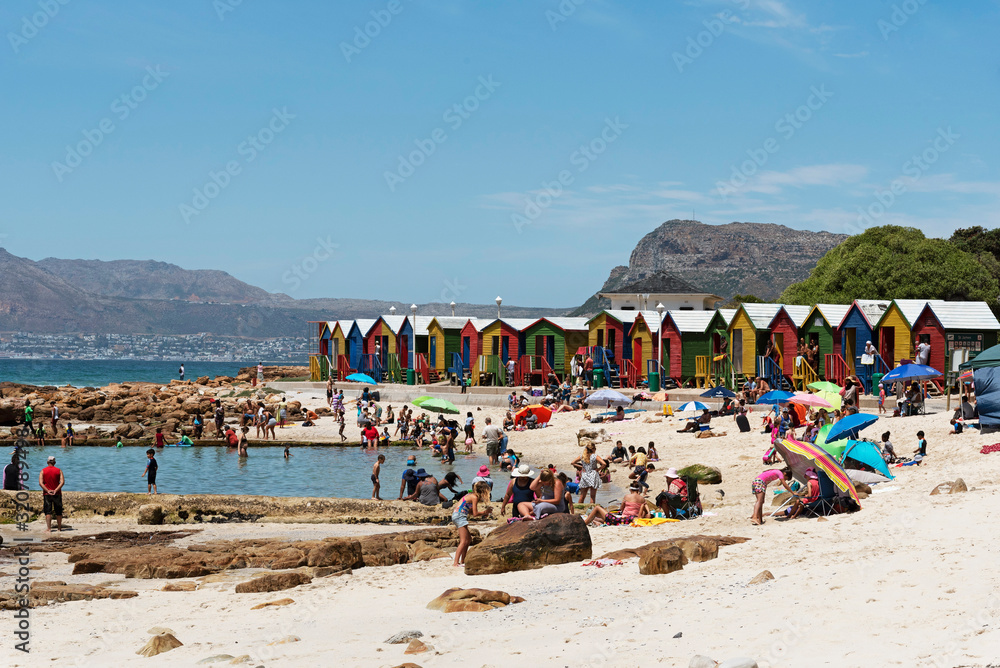 St James, Cape Town, South Africa. Dec 2019. The colourful beach huts and beach at St James beach close to Cape Town