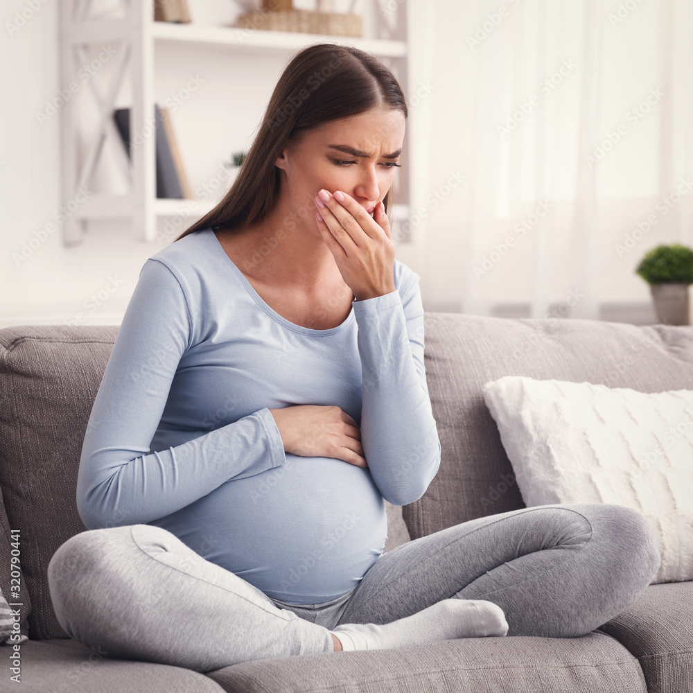 Pregnant Lady Coughing Feeling Sick Touching Mouth Sitting On Sofa Pregnant Lady Coughing Feeling Sick Touching Mouth Sitting On Sofa