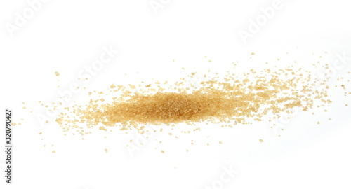 Closeup pile brown sugar isolated on white background. 