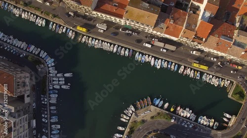 Sunrise top shot on Sète and its channels in the middle of the city. Nice colors and small fishing boats of the Venice of Languedoc.
