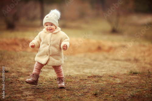 little girl in a white fur coat