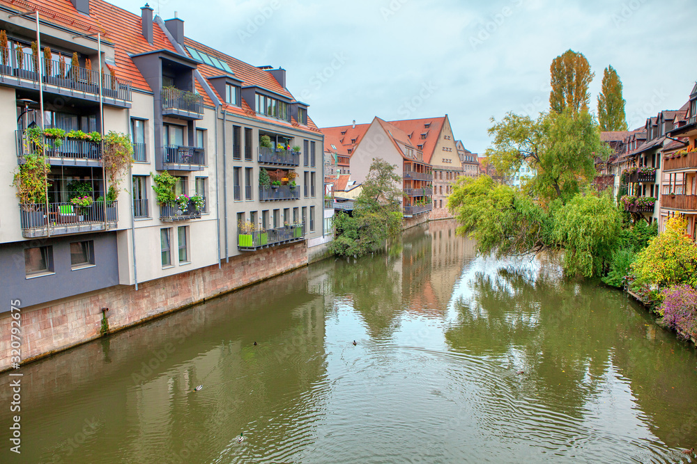 scenery of Pegnitz river with residential houses on the shore scenery of Pegnitz river with residential houses on the shore