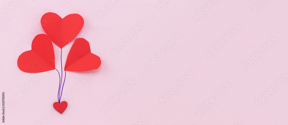 Valentines Day background. Red hearts on pastel pink background. Valentines day concept. Flat lay, top view, copy space