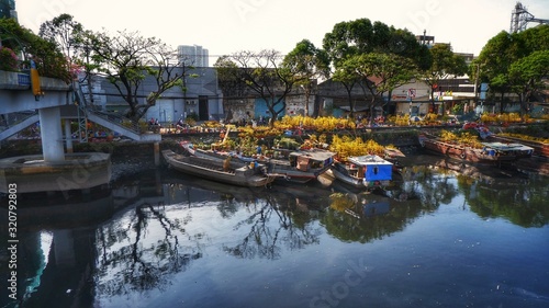 Ben Binh Dong (Binh Dong harbour) in lunar new year with flower boats along side the river © Nguyen Duc Quang