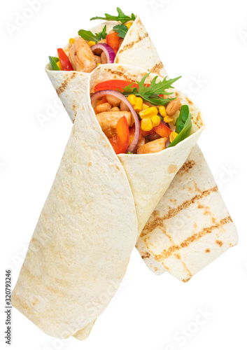 Tortilla wrap with fried chicken meat and vegetables isolated on white background photo