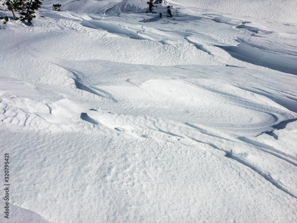 Ripples of snow worked by the wind in the high mountains