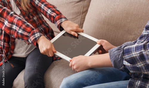 Unrecognizable Greedy Kids Not Wanting To Share Tablet Computer Indoor
