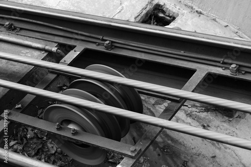 Funicular details. Rails, moving traction cable