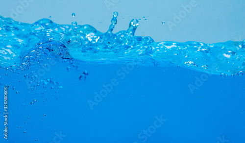 Water and air bubbles over white background with space for text.