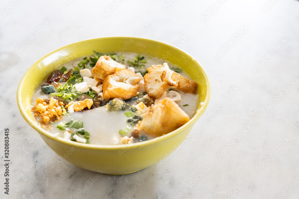 Delicious traditional Chinese congee porridge with youtiao, ginger, pork, scallion Delicious traditional Chinese congee porridge with youtiao, ginger, pork, scallion