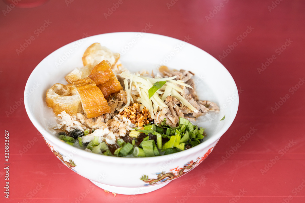 Delicious traditional Chinese congee porridge with youtiao, ginger, pork, scallion Delicious traditional Chinese congee porridge with youtiao, ginger, pork, scallion