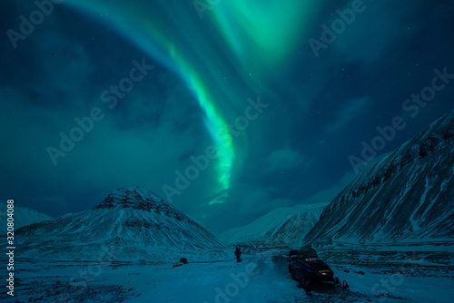 Fototapeta Naklejka Na Ścianę i Meble -  The polar arctic Northern lights aurora borealis sky star in Norway Svalbard in Longyearbyen  with the  mountains. Travel adventure